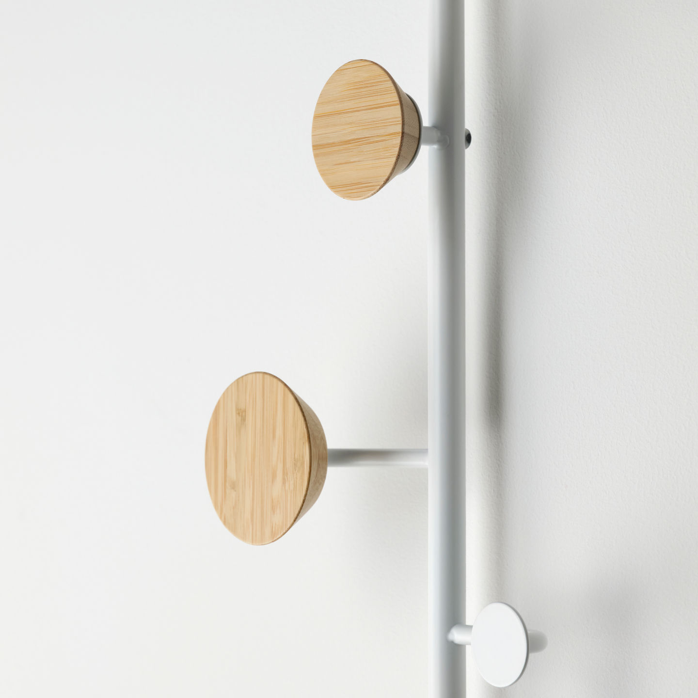 Bärfis—a minimalist Scandinavian hook system designed by Gustav. Featuring a sleek vertical metal rod with three round wooden hooks, it blends functionality and aesthetics, perfect for modern interiors.