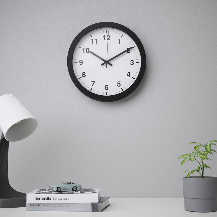 - Tjalla—a minimalist wall clock by Gustav Carlberg, featuring a sleek black frame and a clean white face, perfect for modern interiors and creative workspaces.