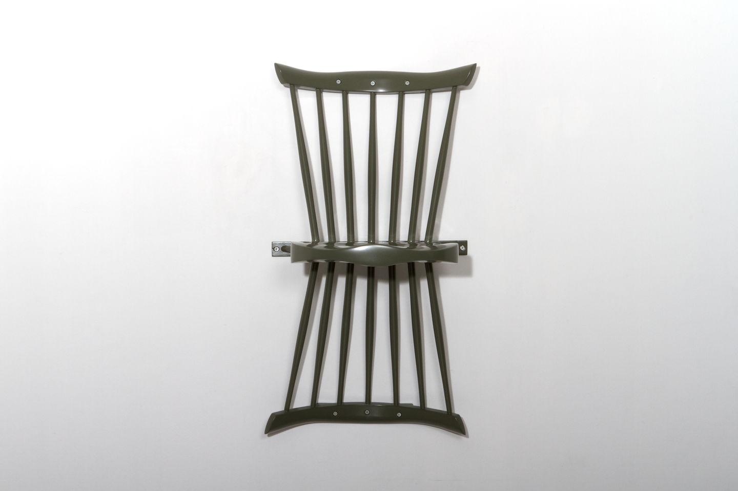 Perspektiv, a mirrored chair designed by Gustav Carlberg, mounts on the wall as a striking sculptural statement, combining artistic reflection with functional seating.