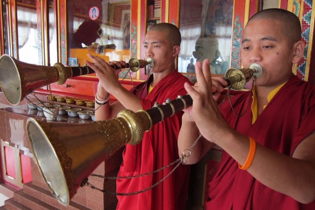 India monks blowing Horn