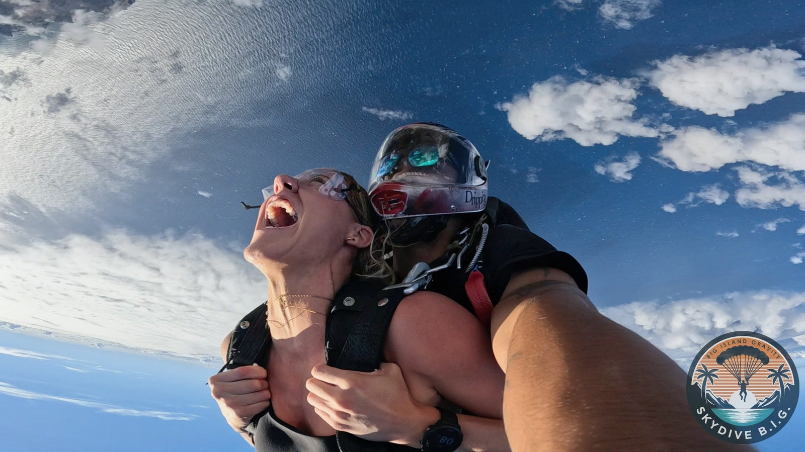 Jumper screaming with joy in freefall above the clouds