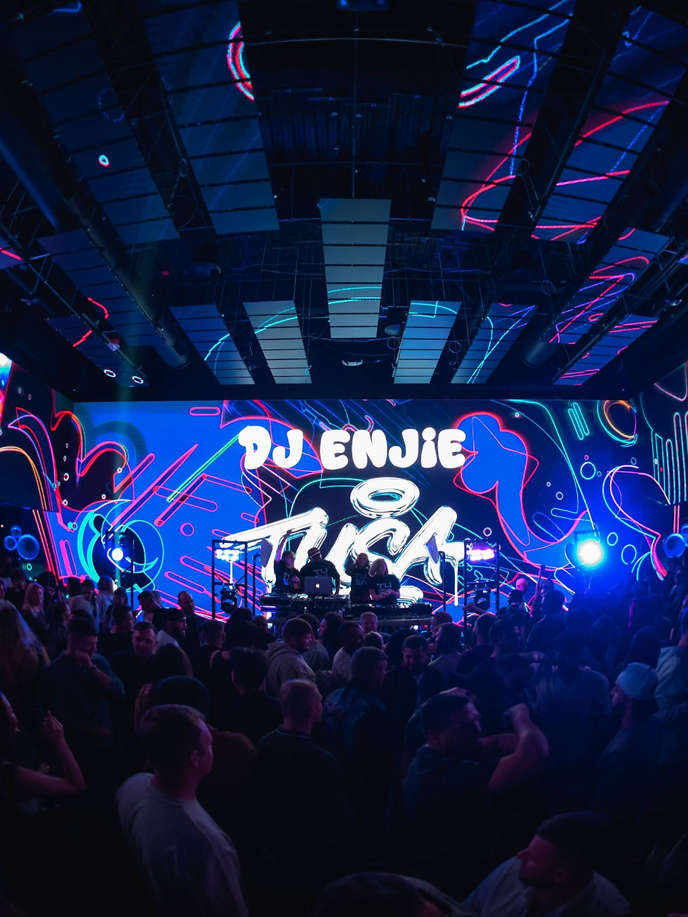 nightlife crowd enjoying DJ music drinks and immersive visuals at Mirra Bellevue