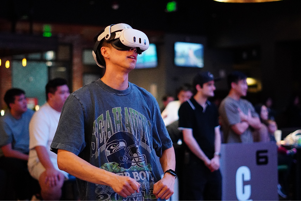 group of adults playing VR games together at Mirra during an adult birthday party Bellevue