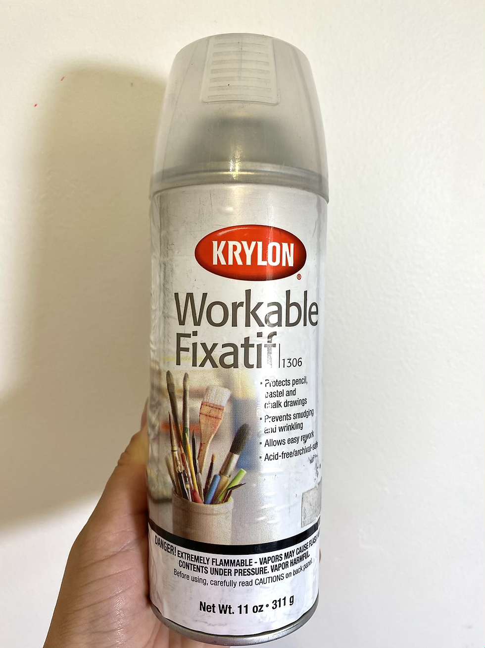 An aerosol can used to protect chalk pastels from smudging.