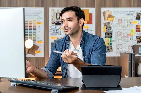 smart-adult-caucasian-designer-with-beard-sitting-on-working-table-desk-video-conference-w