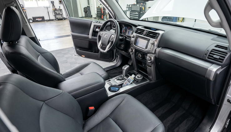 Wide-angle view of a clean vehicle interior after detailing
