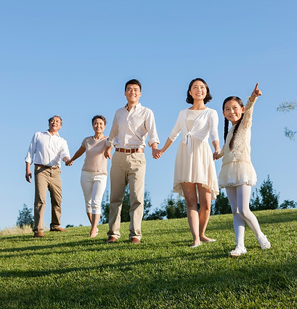 happy-family-holding-hands-looking-at-view-in-a-pa-2024-10-18-02-04-02-utc
