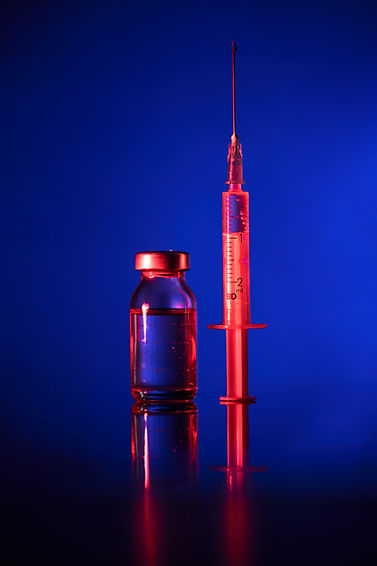 syringe-and-vial-of-medication-on-blue-2026-03-25-05-39-13-utc.jpg