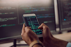 coding-smartphone-in-hands-and-man-programmer-an-2025-04-06-08-38-36-utc.jpg