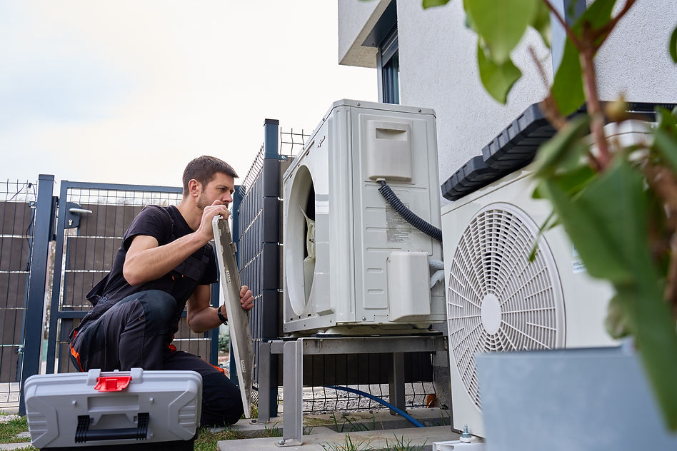 focused-hvac-technician-installing-an-air-conditio-2026-05-05-21-38-59-utc.jpg