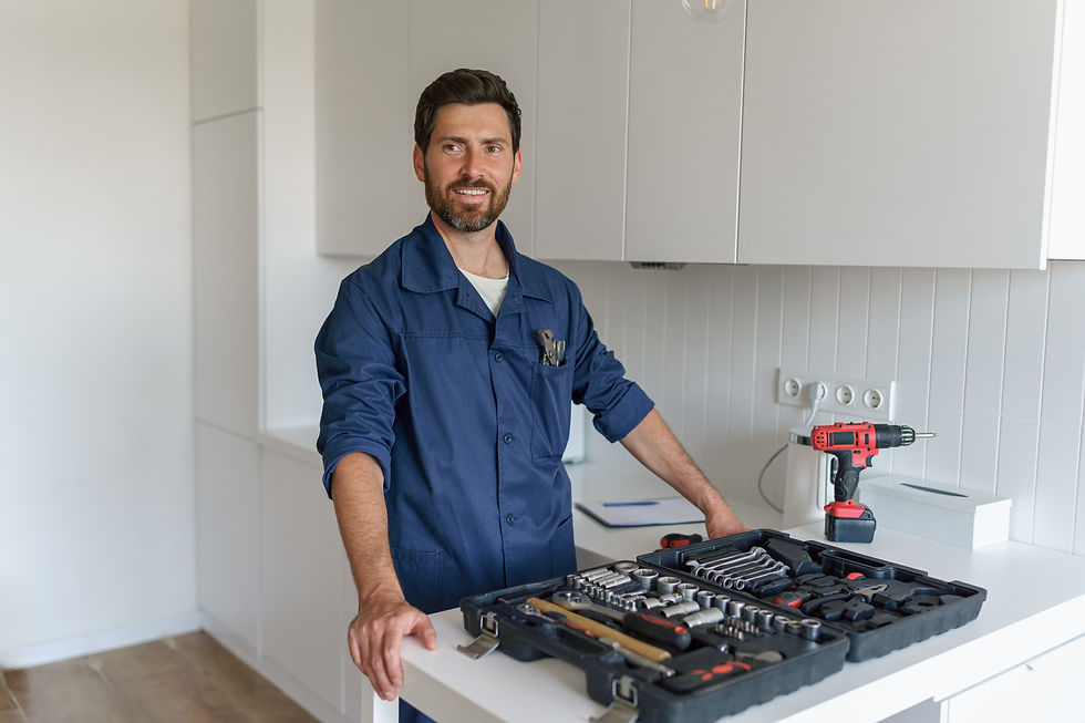 smiling-male-worker-with-toolbox-standing-on-home-2025-03-09-02-32-00-utc.jpg