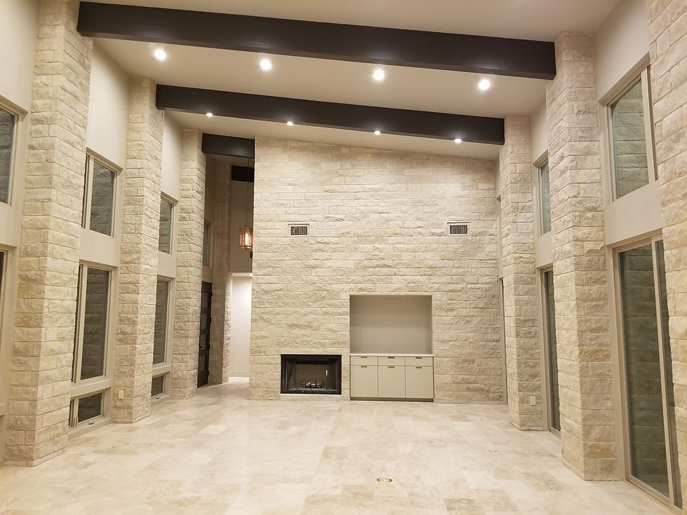 Interior stone masonry fireplace and columns in custom home