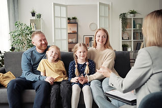 social-worker-talking-to-adoptive-family-at-home-2025-02-11-15-37-56-utc.jpg