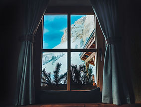 a-mountain-view-through-a-window-in-a-wooden-chale-2026-03-16-00-36-46-utc.jpg