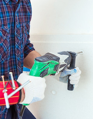 male-hands-hold-puncher-and-and-drills-a-hole-for-2025-01-08-17-40-46-utc.jpg