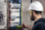 a-male-electrician-works-in-a-switchboard-with-an-2025-03-13-02-47-42-utc.jpg