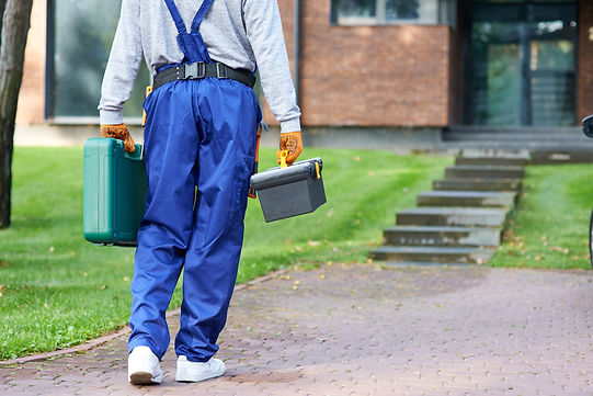 cropped-shot-of-builder-carrying-toolbox-at-cottag-2025-03-25-07-51-43-utc.jpg