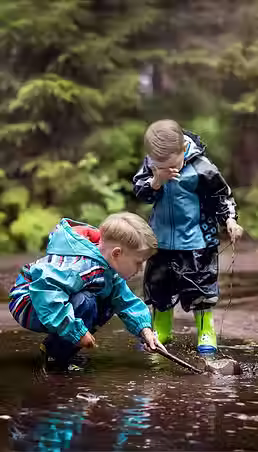 little-children-playing-in-a-puddle-in-countryside-2025-03-08-22-10-57-utc.avif