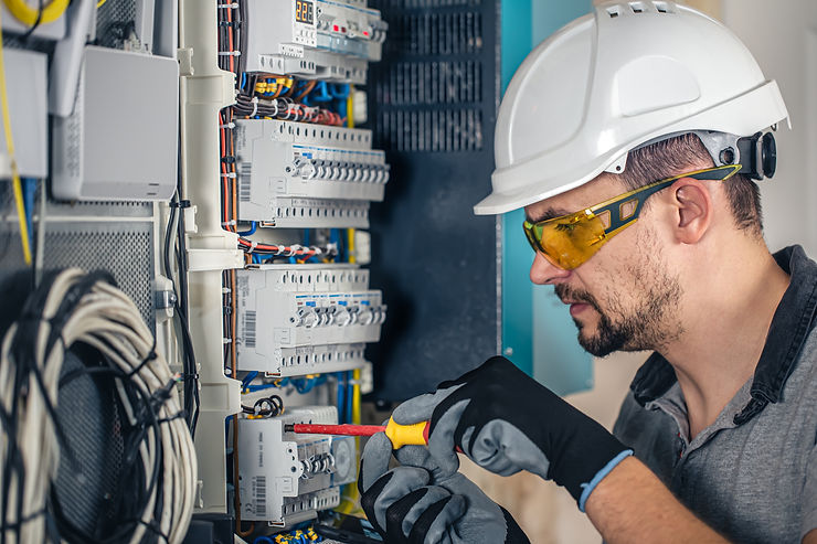 electrician-repairs-a-fuse-box-wearing-safety-gear-2026-01-08-07-58-55-utc.jpg