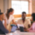 multi-cultural-business-team-meeting-around-desk-i-2026-03-10-03-15-32-utc.jpg