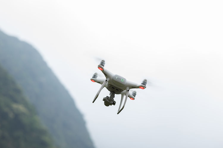 white-drone-with-camera-flying-in-spring-mountains-2026-03-16-00-06-12-utc.JPG