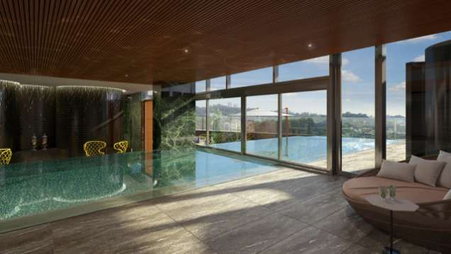 The beautiful and modern rooftop swimming pool of the hotel Four Seasons in Sao Paulo. It is half indoors and half outdoors.