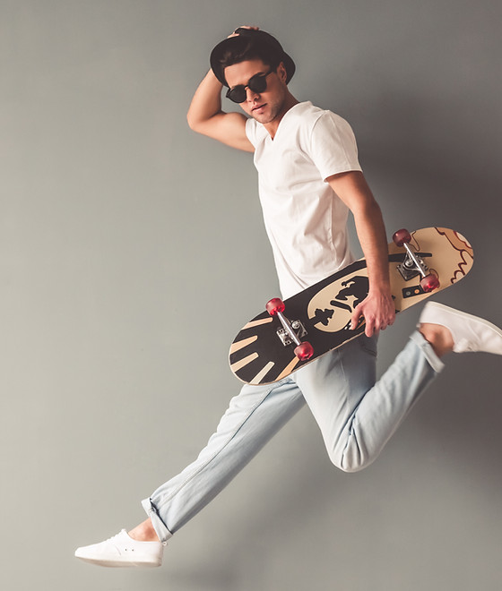 Stylish young man in sun glasses and hat