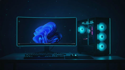 PC gamer com monitor exibindo a área de trabalho do Windows 11 e gabinete com iluminação ciano, ilustrando a atualização Windows 11 26H2