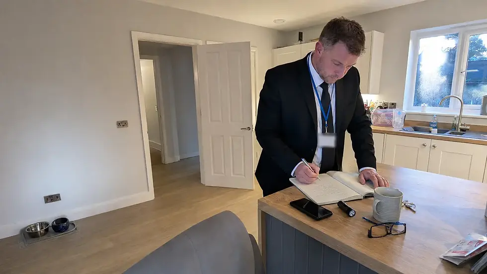 residential security officer writing morning handover notes - Illustrative Image
