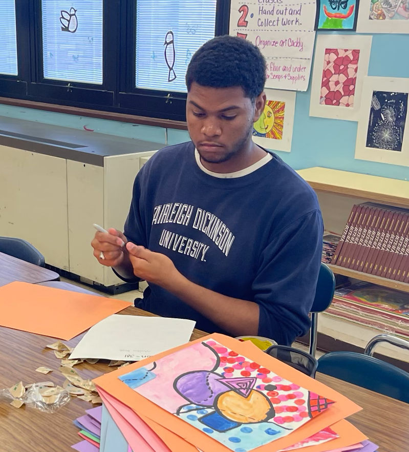 Denzel preparing work for display at PS34