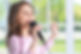 Beautiful little girl with microphone .jpg