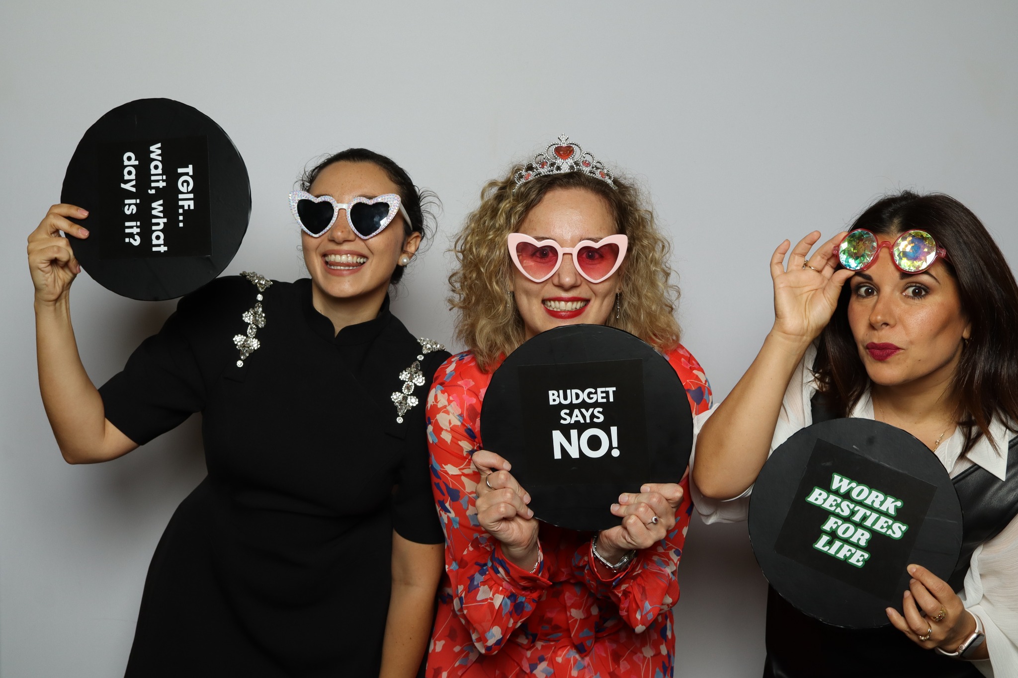 Three guests enjoying a Simple Snaps corporate photo booth at a Sydney event