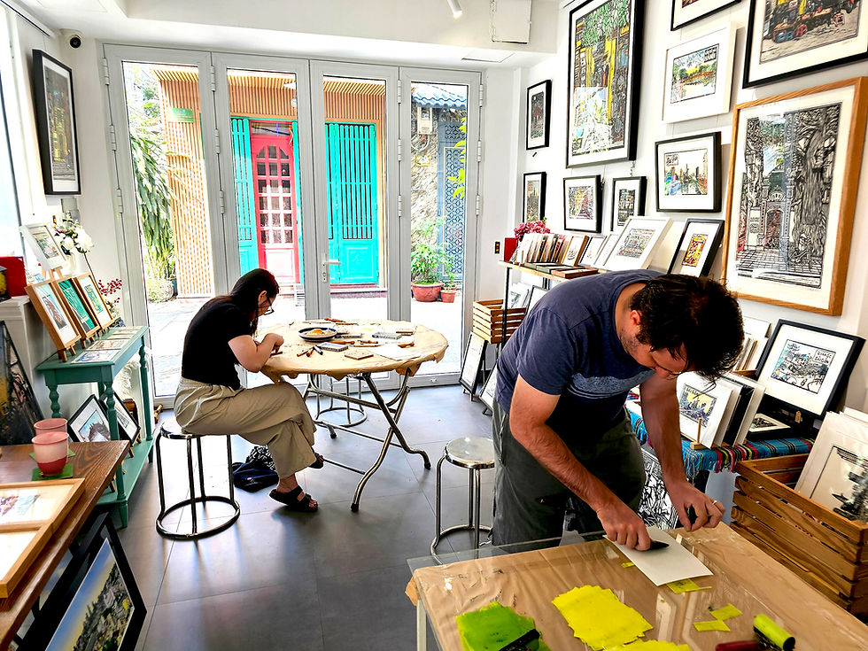 Participant carving a woodblock during private printmaking workshop at Jack Clayton Art Gallery HCMC