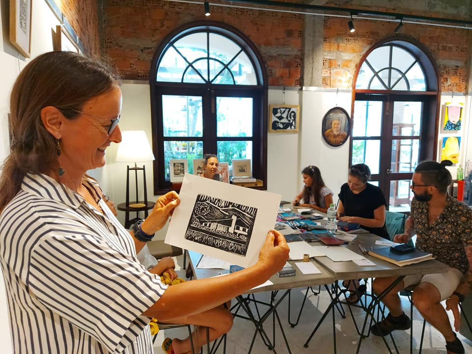 Participants with finished woodcut prints at Anantara Hoi An Resort workshop, Hoi An Vietnam
