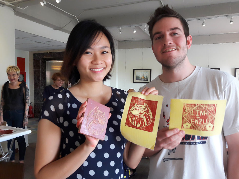 Customer at Thao Dien Art Space woodcut workshop run by Jack Clayton holding their woodcut, D2 HCMC