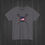 Thumbnail: Charcoal American Lacrosse T-shirt featuring two crossed black lacrosse sticks and a centered round American flag design.