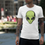 Thumbnail: Man wearing a white t-shirt with a green alien skateboarder graphic and lime green Shredding text