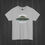 Thumbnail: A sport grey colored t-shirt with bold Area 51 UFO graphic reading “Entering the Forbidden Zone,” exclusive alien design