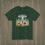 Thumbnail: Forrest green t-shirt with a square graphic of a UFO beaming up a character over a farmhouse