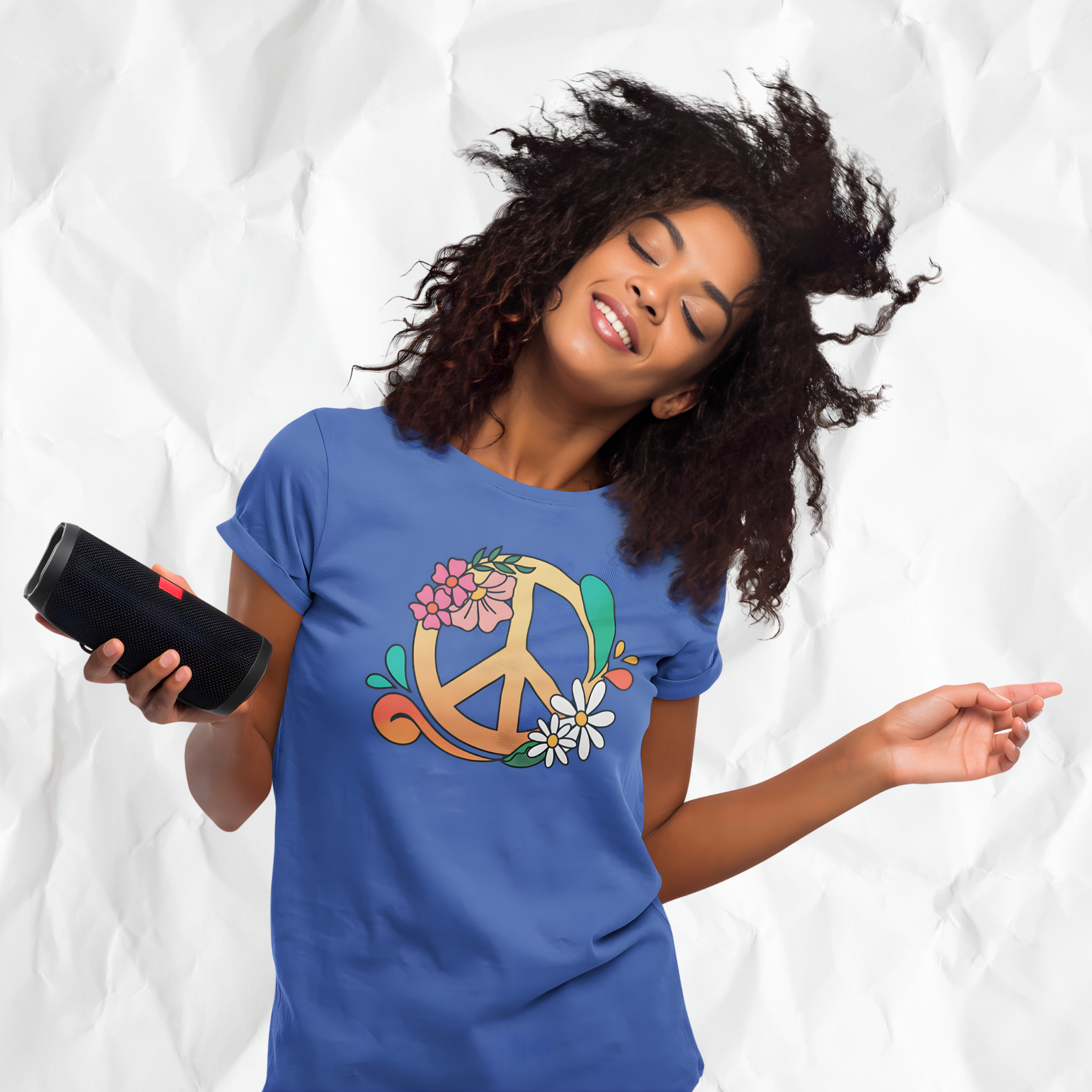 Girl wearing a royal blue colored t-shirt with colorful floral peace sign graphic design by Healey Threads