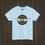 Thumbnail: Light blue classic car t-shirt featuring a green background with a red wings circle design.