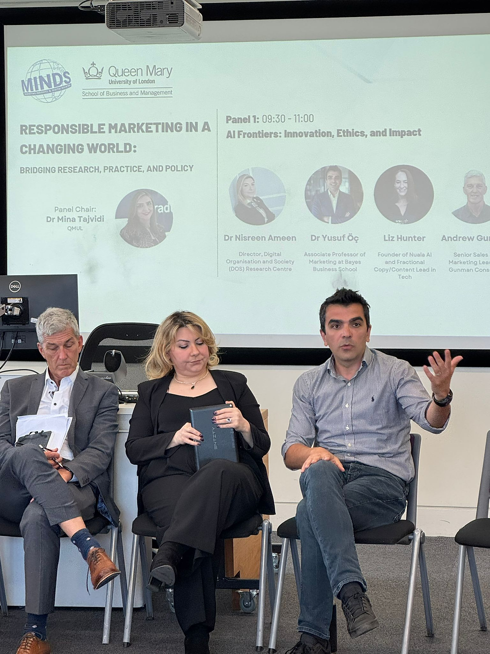 Me at the Panel discussion at Queen Mary University on Responsible Marketing in a Changing World; three speakers sit beneath AI Frontiers slide.