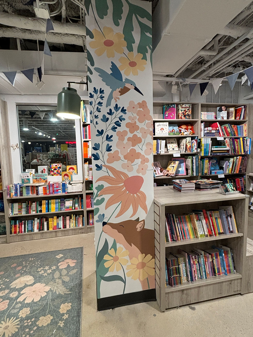 A mural for an independent bookshop's children section. By Alex Mauss Design, a Washington-based muralist. The mural features flowers and animals native to the mid-Atlantic.