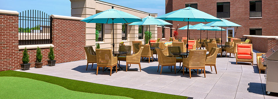 Relaxing patio with tables, chairs, and umbrellas