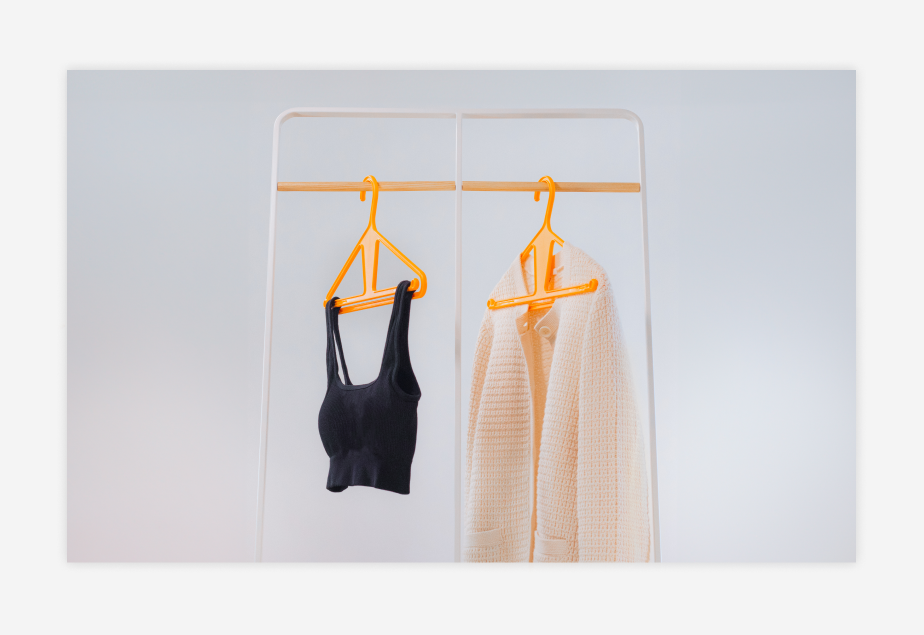 kangaroo hangers holding up two articles of clothing