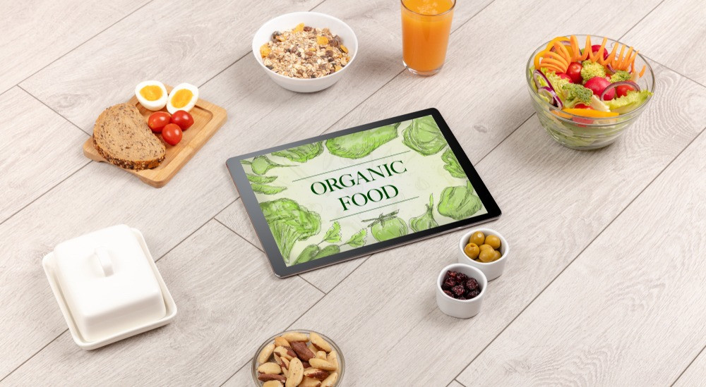 Fresh food on the table with a tablet PC.