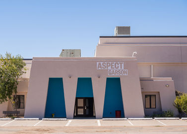 Aspect Garson eastern entrance with logo and distinct blue accent color