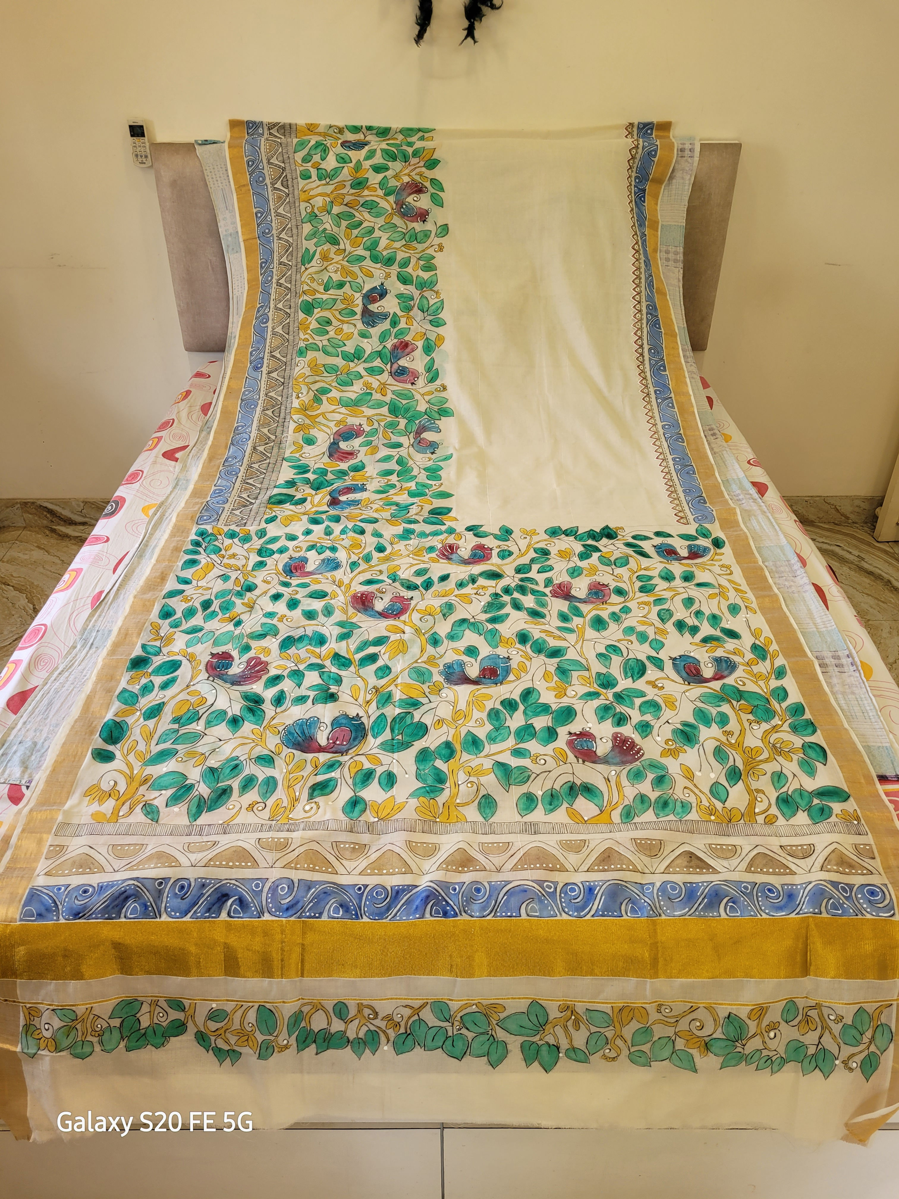 Nature inspired hand-painted cotton saree with a designer blouse piece