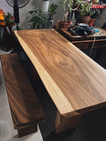 Solid Suar slab table with slab legs paired with matching solid Suar bench.