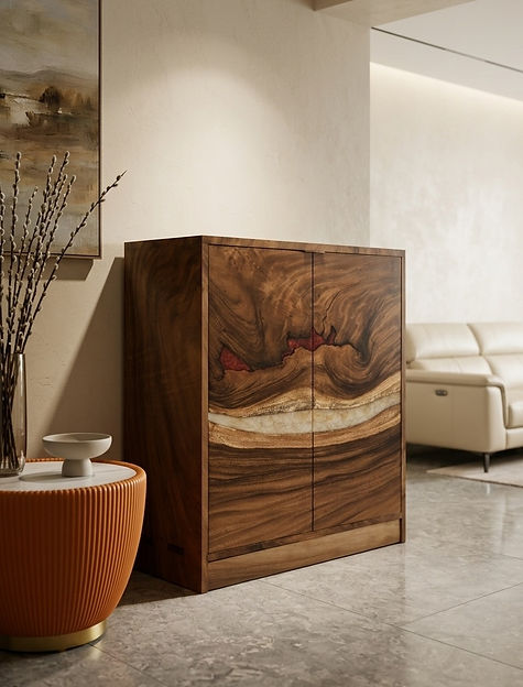 A solid Suar wood hallway cabinet featuring a natural live-edge grain pattern with red and cream resin inlays, set in a modern, sunlit interior with a stone floor and cream sofa.